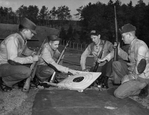 MSgt. James Cazel reviews groupings with fellow marksmen at Sembach A.B. range. Circa 1960