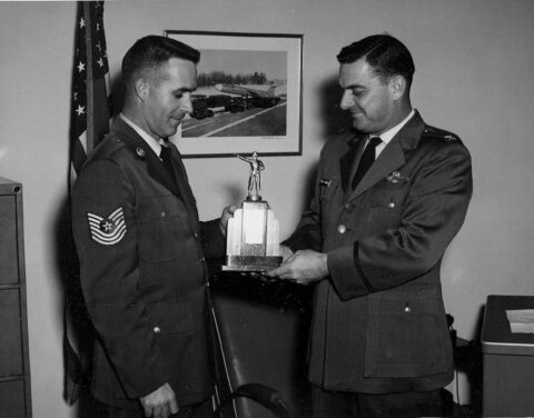 2 November 1960 - MSgt. James E. Cazel presents trophy to Base Commander Col. D. Brawner