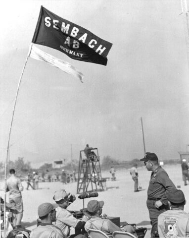 Sembach shooting team at Wheelus Air Base shoot. Team Captain, MSgt. James Cazel at scope with upturned Stetson hat.